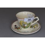 A childs cup and saucer by Meakin having Donald duck, jack and Pluto designs.