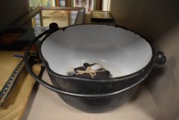 A large cast jam pan having enamel to inside.