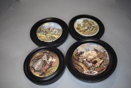 Four antique paste pot lids mounted in wooden frames.AF