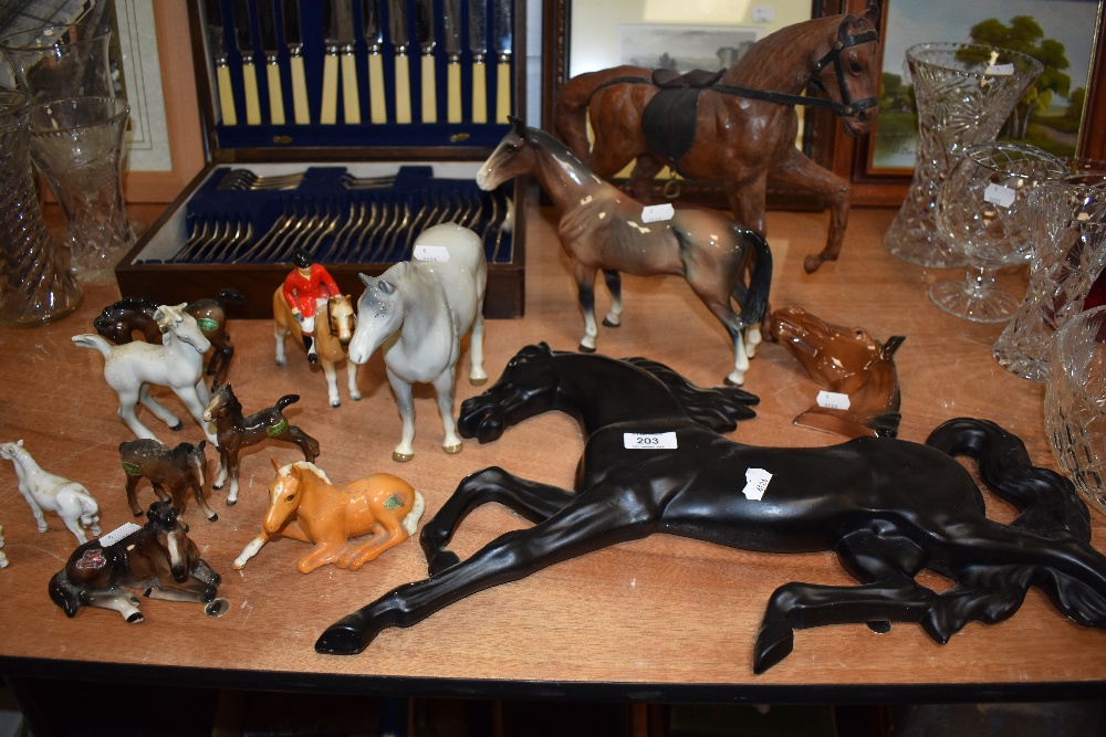 A good selection of horse and pony figurines and a wall plaques including Beswick.
