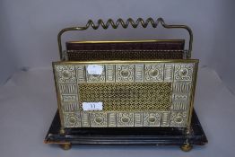 A Ornate vintage brass and wood magazine rack.