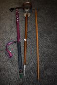 A shooting stick and two ice axes.