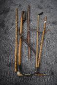 A selection of vintage riding crops including horn handled and two with silver or sliver plated