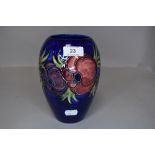 A vintage Moorcroft vase having cobalt blue ground and pattern of anemones.