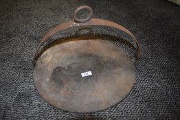 An antique skillet or similar for an open fire.
