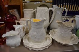 A selection of jugs including mid 19th century wheat embossed jug with Dudson incised to underside.