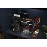 A selection of vintage cameras including Praktika super TL and butchers Watch pocket carbine.