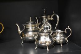 A four piece silver plated tea set of plain circular form having hoof feet