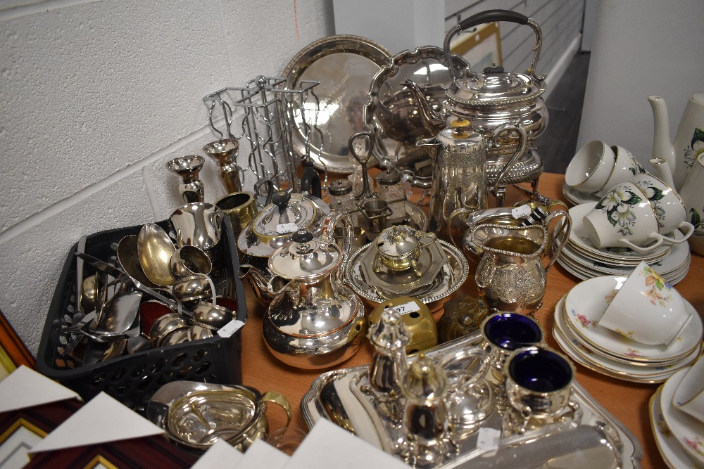 A large lot of plated ware and similar including kettle with stand, serving dish, tea and coffee