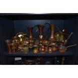 A good collection of copper and brass items including measures, teapots,cider measure and more.