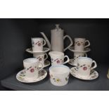 A vintage mid century Crown Clarence coffee set having floral pattern to white ground and blue