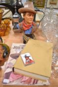 A John Wayne bust and ephemera including book.