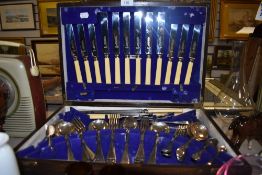 A canteen of vintage cutlery including bone handled knives 'Cutlers silversmiths Roland and company'