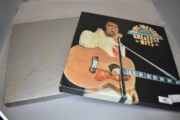 An Elvis Presley vinyl LP box set and a box set of tapes 'the concert years'.