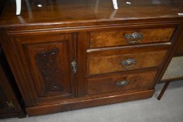 A Victorian mahogany side cabinet having three drawer and cupboard section