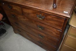 A mahogany chest of two over three drawers with brass handles