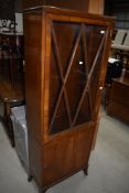 An early 20th Century display cabinet of slim proportions, some damage to beading, no keys and