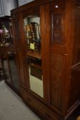 A late Victorian mahogany wardrobe with carved detailing