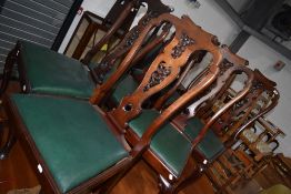 A set of six carved back mahogany framed dining chairs