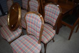 A set of six carved frame oak balloon back dining chairs