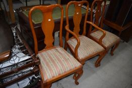 Three reproduction vase back dining chairs in a light stain