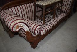 A reproduction scroll arm settee in the Regency style with hardwood frame and striped classical