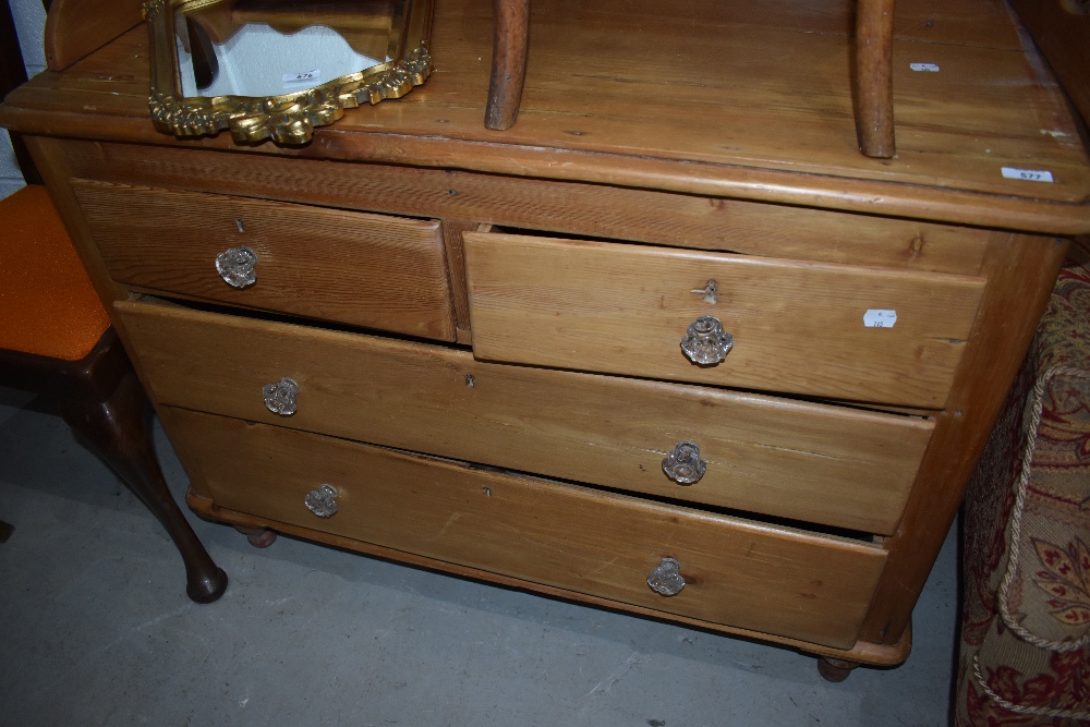 A yellow pine chest of two over two drawers with glass handles