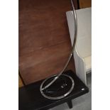 A modernist standard lamp in brushed chrome, height approx. 195cm