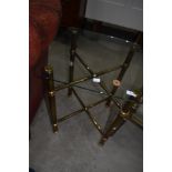 A brass and glass occasional table
