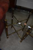 A brass and glass occasional table