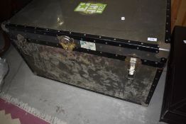 A vintage travel trunk, in a military style, with RAF address labels