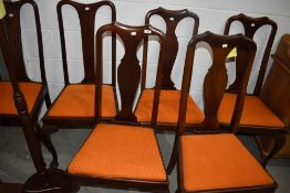 A set of six carved back mahogany framed dining chairs