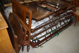 A selection of vintage single bed frames, with bases, labelled for Staples and Co