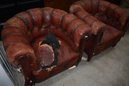 A pair of vintage red leather chesterfield style tub chairs