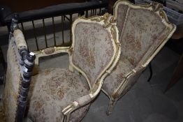 A pair of French painted and carved frame salon chairs