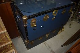 Two large vintage travel or storage trunks