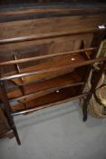 A Victorian stained frame towel rail and wall shelf