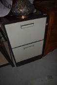 A two drawer metal filing cabinet
