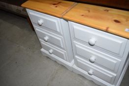 A pair of modern pine and laminate bedside cabinets