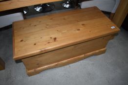 A modern pine bedding or toy box