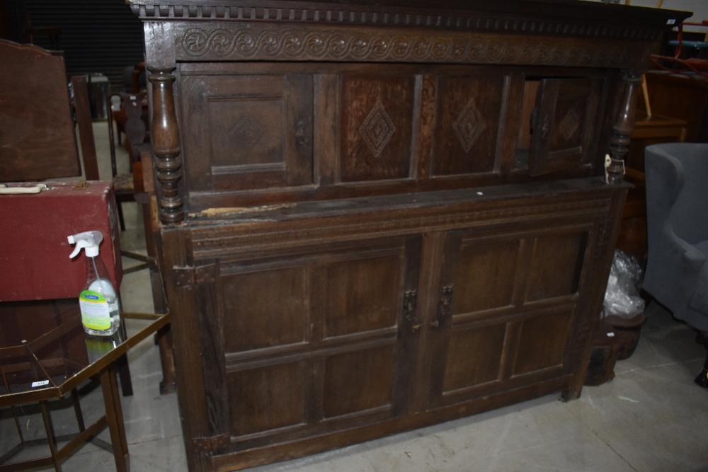 A period oak court cupboard having typical decoration, width approx. 190cm