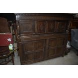 A period oak court cupboard having typical decoration, width approx. 190cm