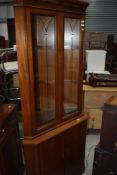 A modern corner cupboard and display case