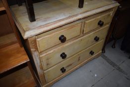 A 19th Century stripped pine chest of two over two drawers