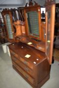 A Victorian dressing table and drawer chest having triple mirror back