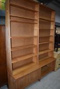A vintage part pine tapered bookshelf , having cupboard and open shelf to base, height approx 240cm,