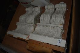 A pair of carved wood corbels