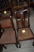 a set of three carved back dining chairs and a similar chair