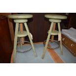 A pair of adjustable stools