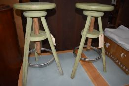 A pair of adjustable stools